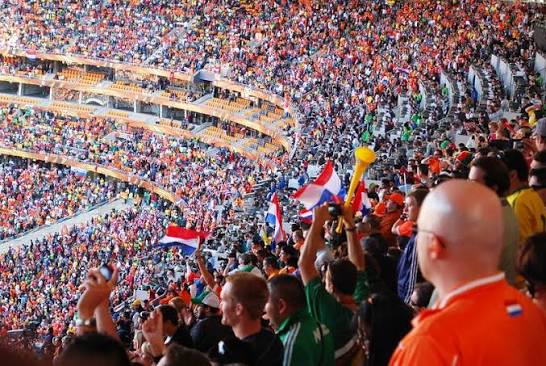  world-cup-fans-in-stadium-waving-flags